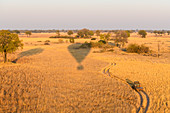 Aerial view of the Okavango Delta from a hot air balloon ride including chase vehicle, Okavango Delta, Botswana, Africa