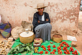 Woman offers vegetables for sale, Sendrisoa, Ambalavao Region, Central Highlands, Madagascar, Africa