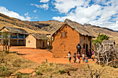 Malagasy children in front of typical house, Tsaranoro Valley, highlands, southern Madagascar, Africa