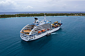 Aerial view of the Aranui 5 (Aranui Cruises) passenger freighter on roadstead, Rotoava, Fakarava Atoll, Tuamotu Islands, French Polynesia, South Pacific