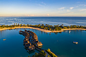 Aerial view of overwater bungalows at Fiji Marriott Resort Momi Bay at sunrise, Momi Bay, Coral Coast, Viti Levu, Fiji Islands, South Pacific