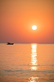 Silhouette of fishing boat at sunset, Ong Lang, Phu Quoc Island, Kien Giang, Vietnam, Asia