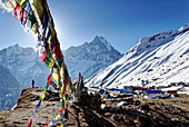Buddhist prayer flags above Annapurna Base Camp, Nepal, Himalayas, Asia.