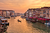 Grand Canal with gondola at sunset from Rialto Bridge in Venice, Veneto, Italy