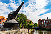 Old harbour with treadwheel crane and Altes Kaufhaus, Luneburg, Lower Saxony, Germany, Europe