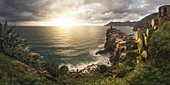 a panoramic view of a golden sunset in Vernazza, National Park of Cinque Terre, municipality of Vernazza, La Spezia province, Liguria district, Italy, Europe