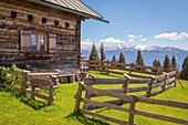 A detail of Achselbodenhütte and its fence with the Tux Alps in the background, Innsbruck, Tyrol, Austria, Europe