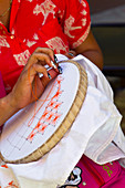 Detail of a woman who embroiders in Trinidad, Cuba