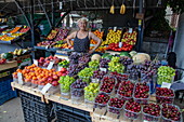 Woman sells cherries and other fruits at a market stall, Pula, Istria, Croatia, Europe