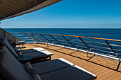 Deck chairs on the aft deck of the expedition cruise ship World Explorer (Nicko Cruises) in the South Atlantic, near Brazil, South America