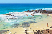 People swimming in Champagne pools, Great Sandy National Park, Fraser Island, Queensland, Australia,