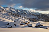 France, Haute Savoie, massif of Aravis, Le Grand Bornand, after a snowfall on the ski area in the Duche valley sunset on the hamlet of the col des Annes