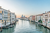 View of the Grand Canal in Venice with St Mark's Basilica dome in the distance.