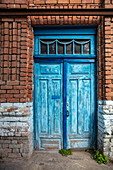 Blue door on red brick house wall, Ulyanovsk, Ulyanovsk District, Russia, Europe