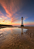 Perch Rock Lighthouse reflected at sunset, New Brighton, Cheshire, England, United Kingdom, Europe