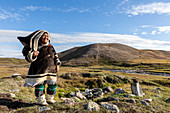 Inuit woman in traditional handmade clothing, Pond Inlet, Mittimatalik, in northern Baffin Island, Nunavut, Canada, North America