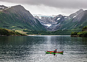 Kayaking in front of the Svartisen glacier, Foroy, Kystriksveien Coastal Road, Norway, Scandinavia, Europe