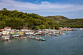 Houses on stilts and traditional Filipino Banca outrigger canoes, Barangay II, Coron, Palawan, Philippines, Asia
