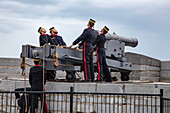 Firing historic cannons at Fort Henry Historic Site and Museum of Living History with uniformed performers known as the Fort Henry Guard performing British military life demonstrations and tours for visitors, Kingston, Ontario, Canada, North America