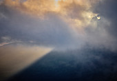 Sunrise over Mount Batur looking through a misty valley near Kinatamali in Bali Indonesia.