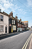 A streetscape with traditional terrace houses in Wish Ward in Rye, East Sussex, UK.