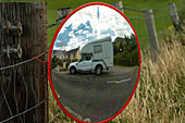 A van in the mirror on a pasture fence, Brandon Creek, County Kerry, Ireland
