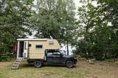 Ford Ranger and add-on cabin directly on the lake in a clearing near Kalvshaga, Småland, Sweden