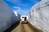 High walls of snow on a milled pass in the East Fjords of Iceland