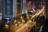 Traffic and skyscrapers in Chengdu at night, Sichuan Province, China, Asia