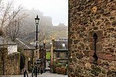 Staircase on Flodden Wall and Edinburgh Castle in the mist, Scotland, UK