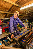 Home weavers, tweed weavers, loom, Shawbost Weavers, Cottage, Isle of Lewis, Outer Hebrides, Scotland UK