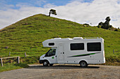 Campers in a parking lot on the South Island, New Zealand