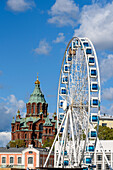 Uspenski Cathedral with ferris wheel in the harbor, Helsinki, Finland