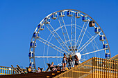 Roof terrace of Allas Sea Pool and ferris wheel with sauna gondola at the harbor, Helsinki, Finland