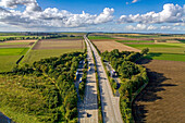 Aerial view, unmanaged parking space on the A7, parking spaces for trucks, German autobahn,