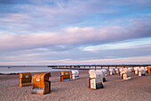 Beach chairs in front of the pier in Großenbrode, Baltic Sea, Ostholstein, Schleswig-Holstein, Germany
