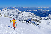 Woman on ski tour climbs up to Oberlercherspitze, Oberlercherspitze, Maltatal, Hohe Tauern National Park, Ankogelgruppe, Hohe Tauern, Carinthia, Austria