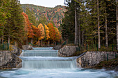 Colorful autumn forest, waterfall, Walchensee, Bavaria, Germany