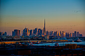 Dubai, skyline, flock of birds, dusk, sunlight