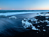 Chunks of ice on the black beach at Jokulsa, Sudausturland, Iceland, Europe