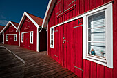 Red boat houses on the archipelago island of Tjörn in the west of Sweden
