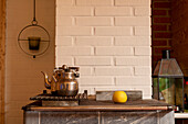 Two teapots, fireplace, baked apple, still life, Lapland, Finland