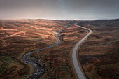 Road curves of the Wilderness Road, on the Vildmarksvagen plateau in Jämtland in autumn in Sweden from above