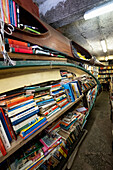 View of books stacked in boats in the Libreria Aqua Alta in Venice, Veneto, Italy, Europe