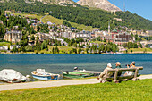 Tourists enjoy the sun on Lake St. Moritz in spring, Upper Engadin, Graubünden, Switzerland