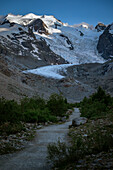 Hiking trail on Morteratsch Glacier in the Engadin in the Swiss Alps in summer