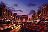 Triumphal arch in a city at night, Arc De Triomphe, Paris, Ile-de-France, France