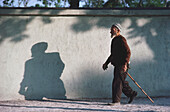 Senior man walking with cane, Turkey