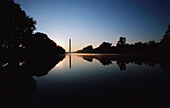 Reflection of a monument on water, Washington Monument, Washington DC, USA