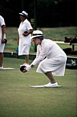 Woman playing bocce ball, Sydney, New South Wales, Australia